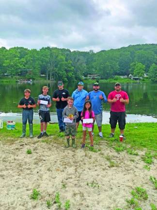 Prize winners in the fishing contest pose for a photo.