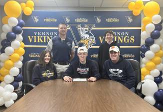 Vernon Township High School senior Ty Holden, center, agrees to play lacrosse at Western Connecticut State University next year. Seated with him are his parents, Lori and Bill. Standing are Adam Coleman, head boys lacrosse coach, and Mason, Ty’s cousin. (Photo provided)