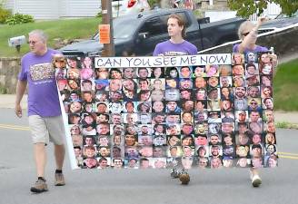 Participants march in support of addiction recovery, 2021.