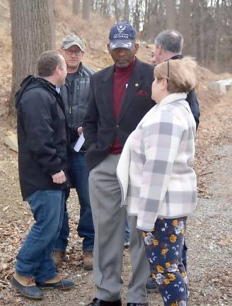 Vernon Township Mayor Howard Burrell talks to Environmental Commission member and Silver Spruce Drive resident Peg Distasi on Thursday.
