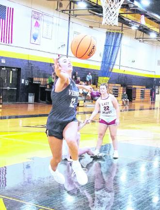 Vernon's Monica Curry reaches for the ball during a rebound. Curry scored 23 points in the game.