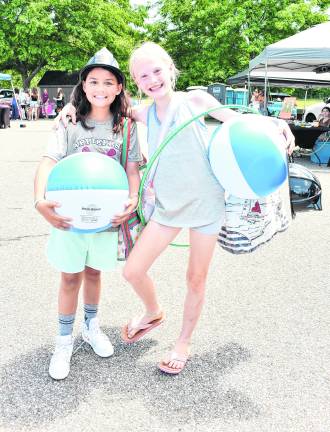 <b>Mikayla Hayes of Warwick, N.Y., and Natalie Rockwell of Wantage hold beach balls.</b>