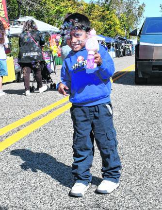 <b>Xander Duahuizo of New York blows bubbles.</b>