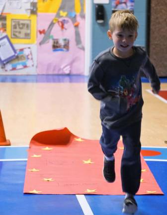 One Walnut Ridge first-grader runs down the red carpet to his Oscar Award.