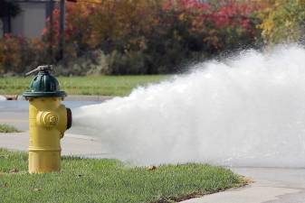 An example of an open fire hydrant and full blast.