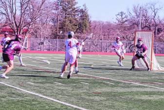 High Point’s Dan Cunha (4) carries the ball with his crosse as he approaches the goal post in the season opener Thursday, March 27. Newton won, 15-3. (Photos by George Leroy Hunter)