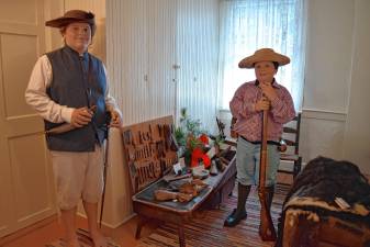 <b>The Ziccardi brothers August, 11, and Heath, 10, by a cobbler’s bench with tools and old shoes in the DAR Van Bunschooten Museum in Wantage. (Photos by Theresa Esposito)</b>