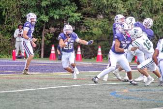 <b>PJ1 Pope John running back Luke Gialanella carries the ball in the season opener against DePaul on Saturday, Aug. 30. DePaul won, 31-3. (Photo by George Leroy Hunter)</b>