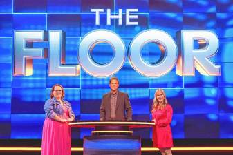 Jeorgi Smith, right, competes on season three of ‘The Floor,’ a game show hosted by Rob Lowe, center, on Fox. (Photos provided)