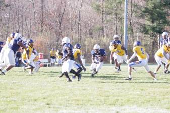 Running back Thaylor Siblies of the Sussex Skylanders carries the ball in the game against Monroe College on Saturday, Nov. 18. He made one touchdown and the team won, 47-27. (Photos by George Leroy Hunter)