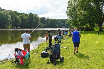 <b>Residents take part in the annual fishing contest Saturday, July 12 at the Lake Neepaulin Beach in Wantage. It was organized by the township’s Recreation Committee. (Photos by Maria Kovic)</b>