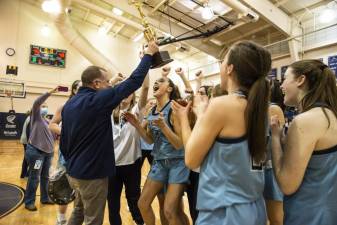 The Sparta High School girls basketball team celebrates its win in the Hunterdon/Warren/Sussex Tournament. (Photos by John Hester)