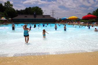 Visitors are shown enjoying the up and down motion of the Hightide Wavepool at Mountain Creek Water Park in 2016. The Vernon Township Council and MUA approved a settlement with Mountain Creek on Thursday night to resolve the resort's $28 million sewer debt.