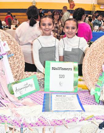 <b>Auralia and Aviana Clifton from Wallflowers are shown.</b>