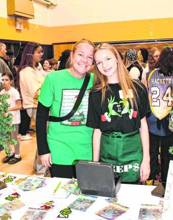 <b>Shay Karkowski is shown with her mother, Sherri, at the Shay’s Sparkle Shop table.</b>