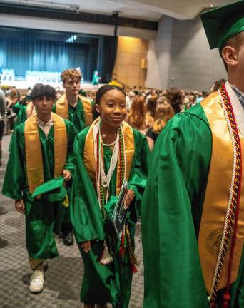 Graduates walk out after the ceremony.