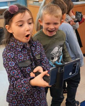 Students are in awe over an erupting volcano.