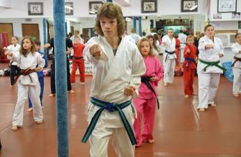 Vernon Valley Karate students practice a kata - specific order of self-defense techniques.