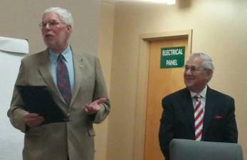 Vernon Township School District Board of Education member John McGowan, left, speaks after being presented with a proclamation honoring his service by Vernon Township Council president Patrick Rizutto in 2015. (File photo)