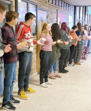 High Point students work hard to pass food and pantry items quickly.
