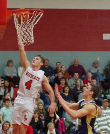 High Point's Kyle Adams up high in the fourth period. Adams scored a game high of 25 points.