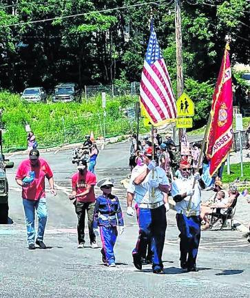 <b>The color guard marches with the flag.</b>