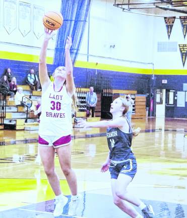 Newton's Caitlyn Pokrywa leaps during a shot. Pokrywa scored 12 points.