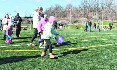 <b>Children hunt for Easter Eggs at Maple Grange Park in Vernon Township.</b>