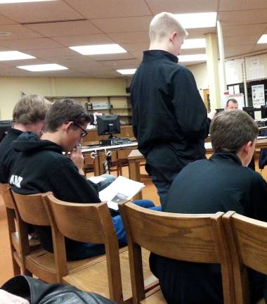 Photo by Lori Comstock Wallkill Valley athlete Nick Hoyle talks to the Board of Education against a combined indoor track team with High Point.