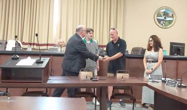 L-R: Vernon Councilman Brian Lynch, The Track Deli owners Pat Mitchell and Scott Jahnke, and Council Vice President Natalie Buccieri.