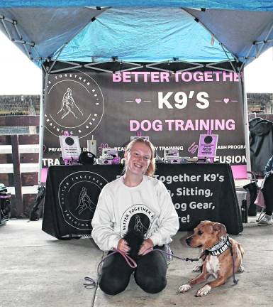 <b>Courtney Breuer of Batter Together K9's poses with Nala.</b>