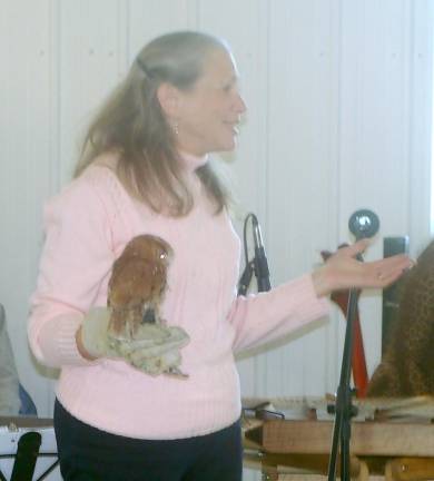 Giselle Smisko of the Avian Center displays an owl.
