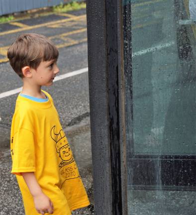 A Cedar Mountain Kindergarten student approaches the school bus.