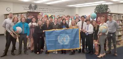 They are pictured here with advisors Guy Della Tore (at left) and Kelsey Falkowski (at right), both teachers in the Social Studies department.