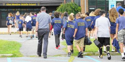 Seventh-graders enter Glen Meadow Middle School on the first day of school back in September, before everything changed.