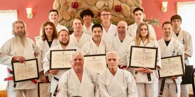 In front row are Sensei Tom Shull, left, and Sensei Chuck Ercolano. In middle row, from left, are Tim Duvelsdorf, Connor Shillcock, Timmy Duvelsdorf, Paul Doumanis Jr., Jose Gomez, Paul Doumanis, Taylor Schoenfeld and Nick Vigiletti. In back row, from left, are Jake Remington, Eric Rosario, Cody Williams, Scott Wolven and Wade Riley. (Photo provided)