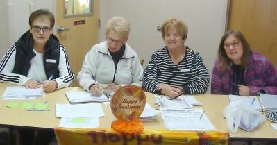 Pantry volunteers from left: Gail, Fran, Cathie and Robyn are busy keeping the food distribution organized and moving.