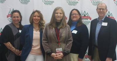 German Christmas Market committee president Sabine Watson, center, poses with representatives of three charities with whom the market has longest-running relationship. From left are Valerie Macchio of the Sparta Community Food Pantry, Athena Storm of DASI, and Megan MacMullin and Rich Lecher of SCARC. (Photos provided)