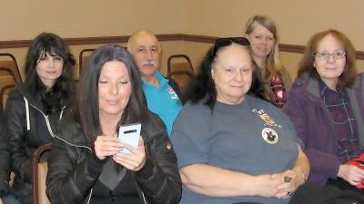 Danielle Varon (left) sits with supportive members of the Bear Group as she awaits her Jan. 21 trial.