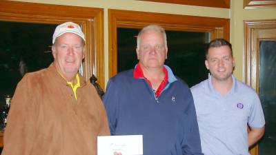 Peter McIntyre and Bob Setz receive their Low Gross winner’s prize from General Manager Ryan Delaney.