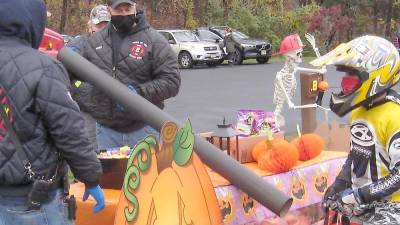 McAfee Fire Department built a no-contact tube to shoot candy into trick-or-treaters’ bags (Photo by Janet Redyke)