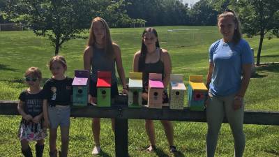 The 4H Krafty Krafters Club painted and hung birdhouses built and donated by students in Mr. Wagner's Building Trades Class at Vo-Tech. Woodbourne Park now sparkles with the new additions to the already growing birdhouse neighbors from past years.