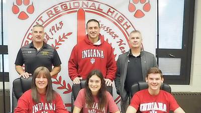 High Point's Zoe Tiger, seated middle, signs her National Letter of Intent to continue her soccer career at Indiana University next fall. Pictured are seated from left to right - mother Cindy, Zoe, and brother Troy. Standing from left to right are Director of Athletics/Assistant Principal Todd Van Orden, father Jahn, and Head Girls' Soccer Coach Kevin Fenlon.