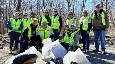 Volunteers filled 10 bags of recycled trash and eight bags of household trash during the cleanup.