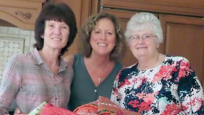 Goodies and personal hygiene supplies are stacked and ready to be stuffed into stockings for Operation Yellow Ribbon by members of the Vernon Township Woman's Club.