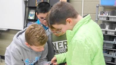 Students type in a code during their Escape Room