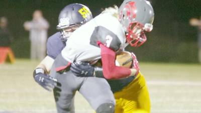 High Point ball carrier Connor Lake is grabbed by Jefferson defender Richie Raymond in the second half