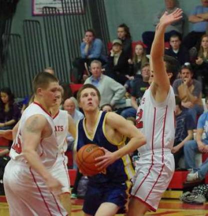 Vernon's Phillip Thompson eyes the basket just before he shoots the ball. Thompson contributed 16 points in the game.