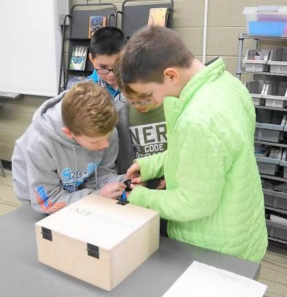 Students type in a code during their Escape Room