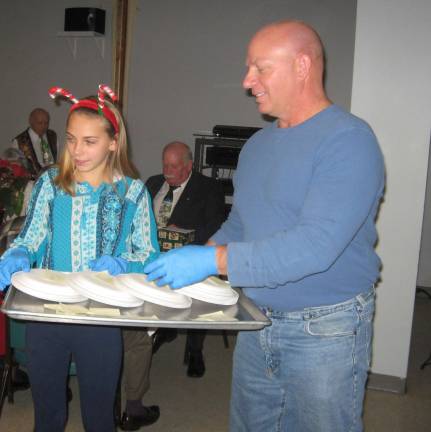 PHOTOS BY JANET REDYKE Father and daughter Sidney and Mark Van Tassel offered their help as volunteers at the celebration.